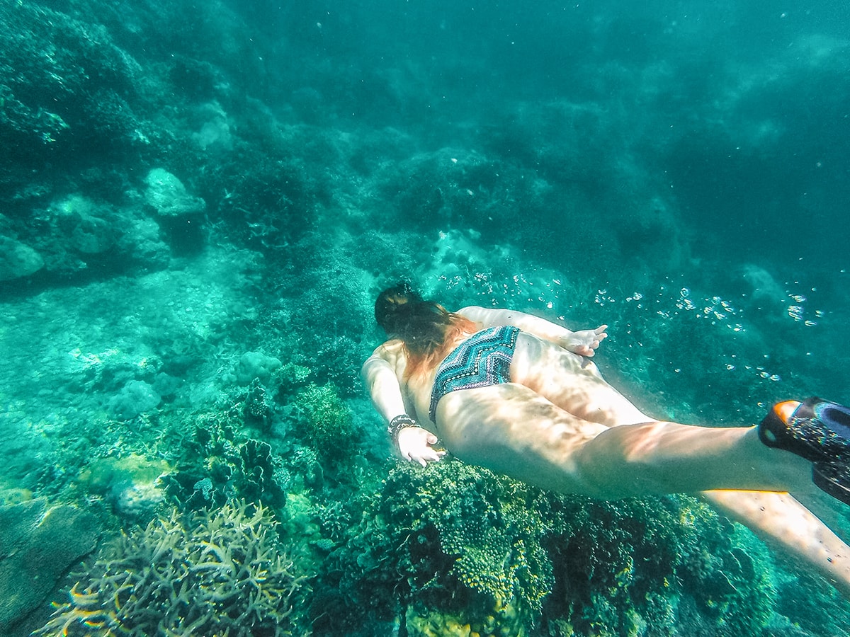swimming underwater on a snorkeling tour vietnam