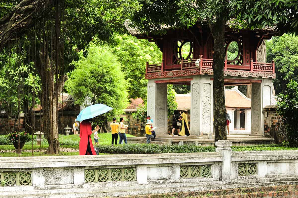 the lush and pristine gardens at the temple of literature in hanoi
