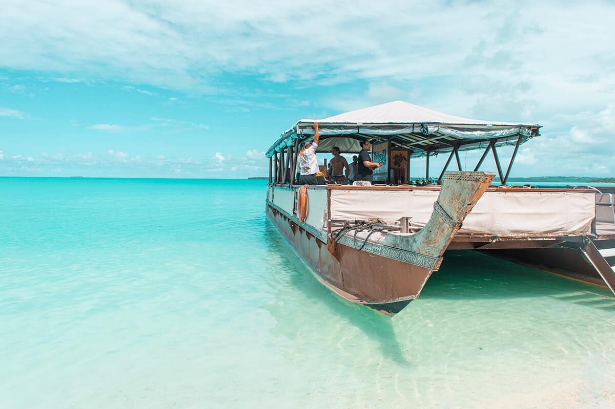the vaka cruise boat in aitutaki sitting in the lagoon