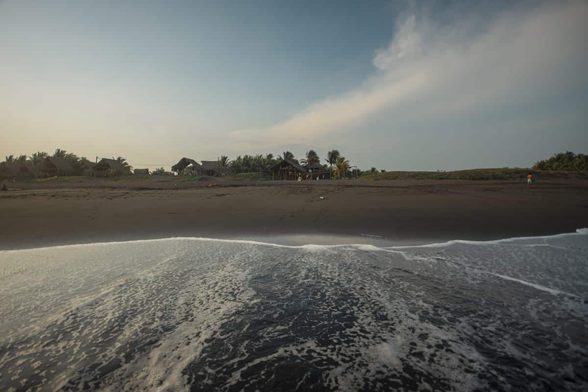enjoying the water at el paredon looking back to the driftwood surfer hostel
