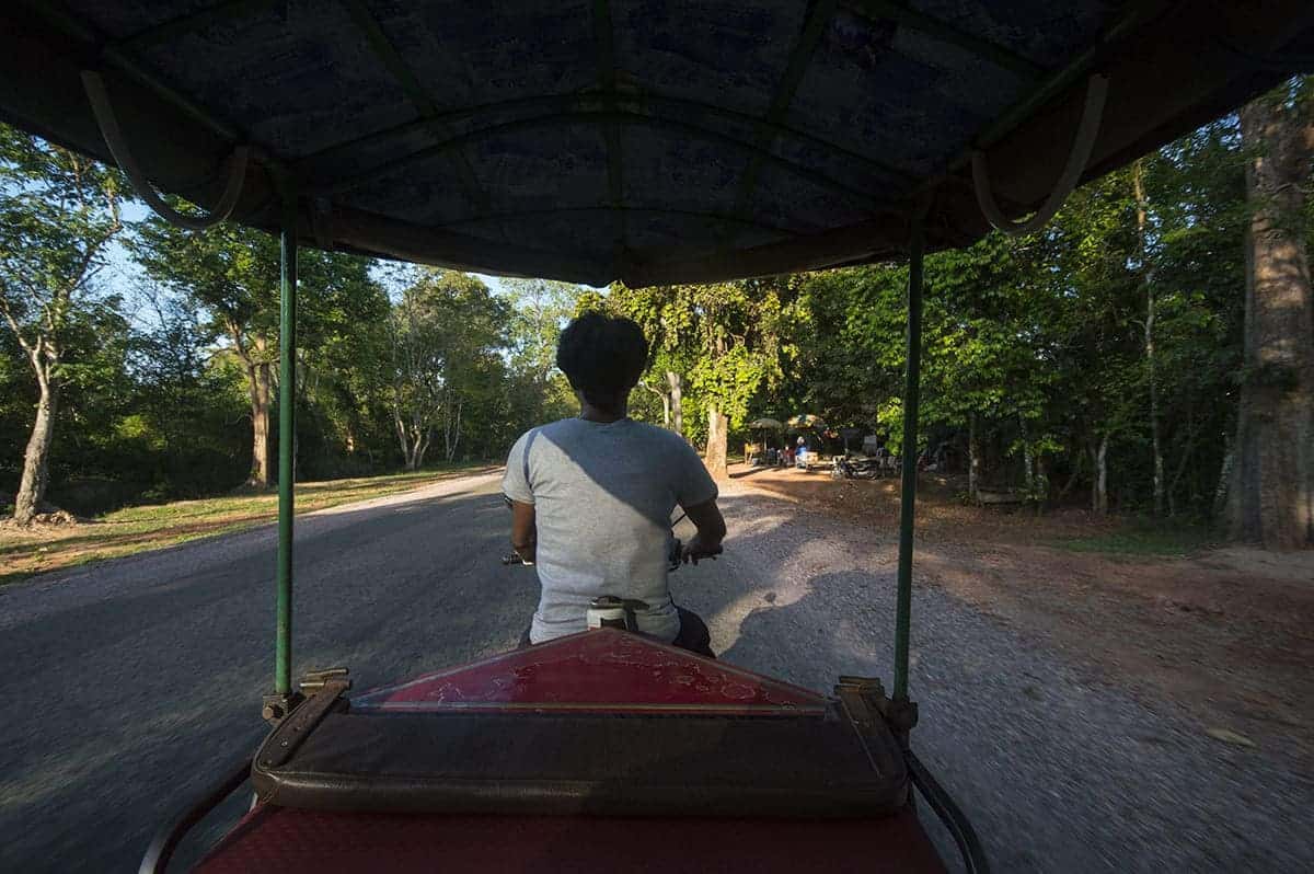 taking a tuk tuk is a great way to travel around cities when in cambodia