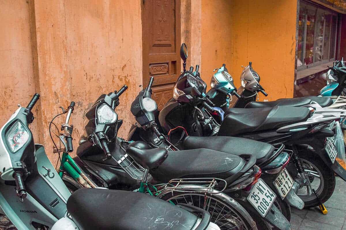 scooters lined up in the streets of hanoi