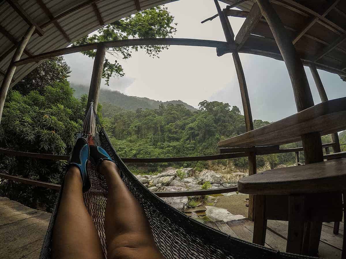 hanging out in a hammock at pico bonito national park in my water shoes