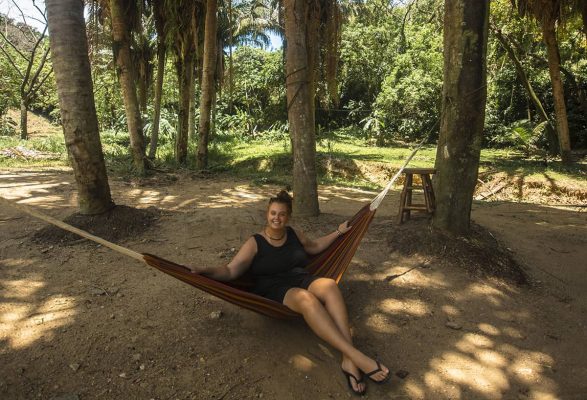 hanging out in a hammock while backpacking honduras