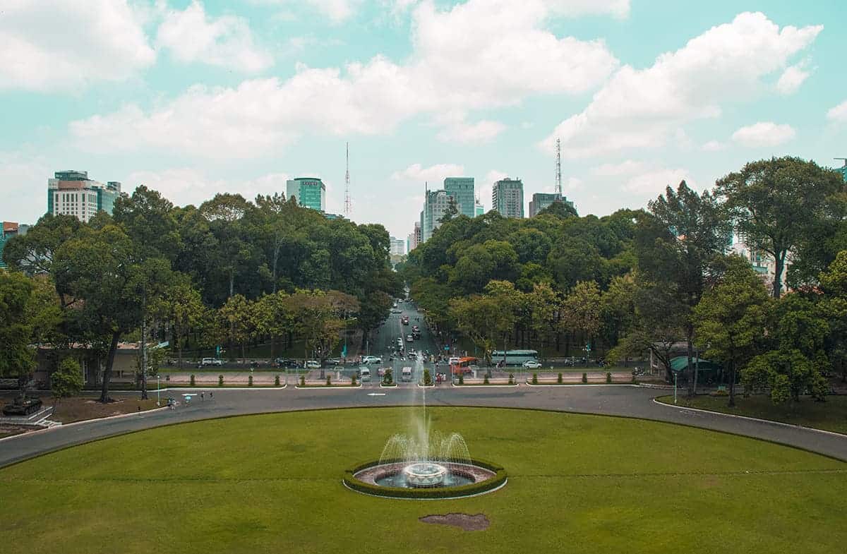 Backpacking Ho Chi Minh City (Saigon): My Top Travel Tips 13 the view over the grass area infront of the reunification palace in ho chi minh city