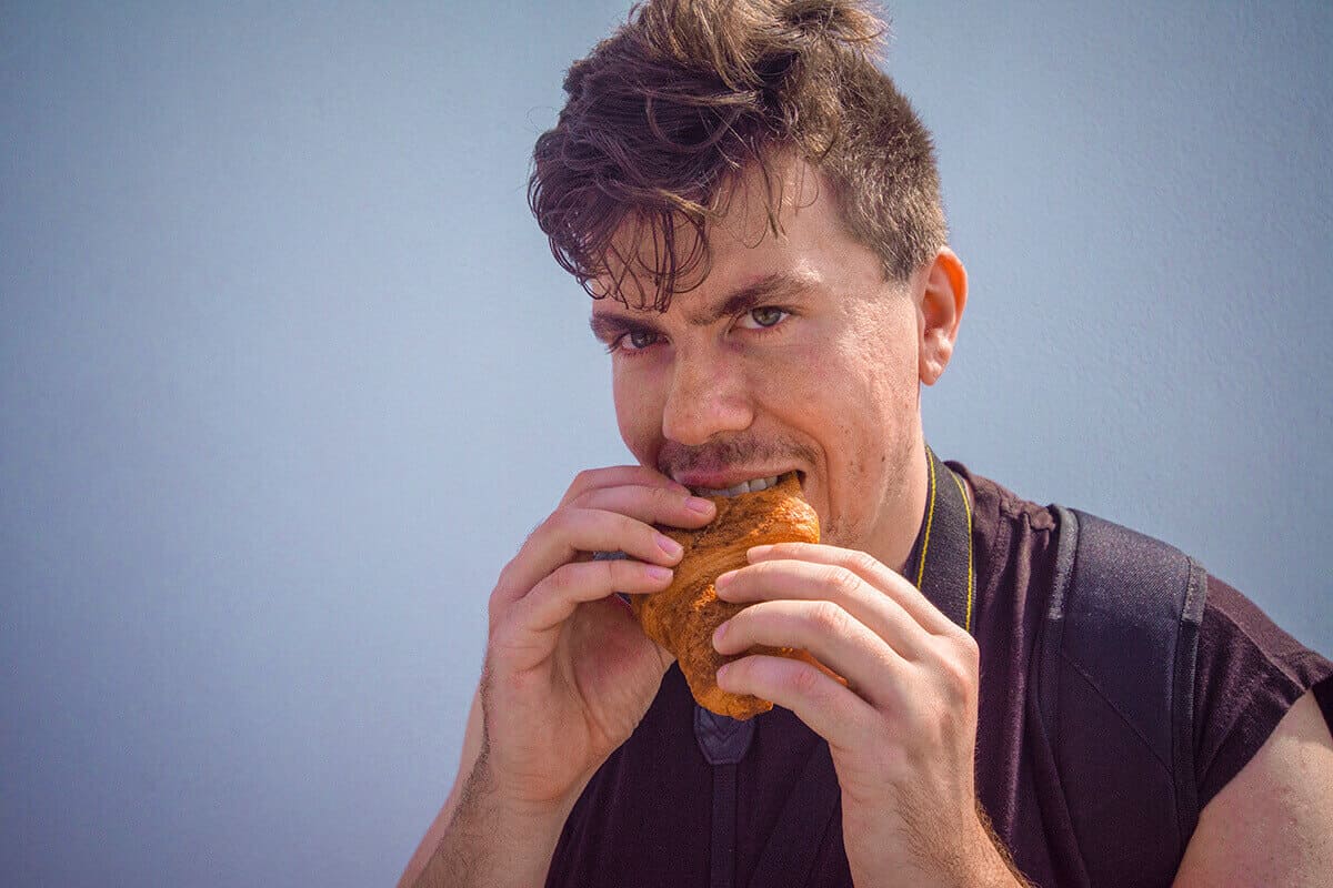 Backpacking Santorini On A Budget: All You Need To Know 11 having lunch backpacking santorini on a budget