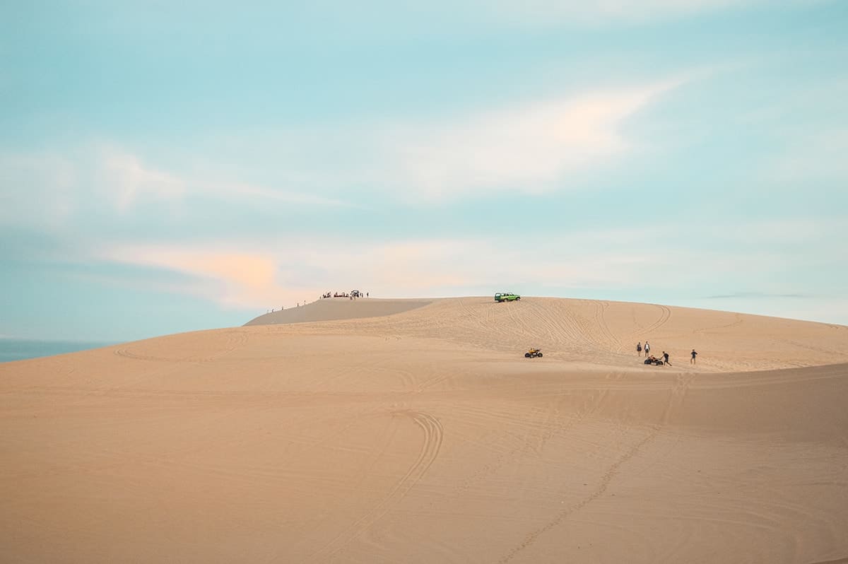 exploring the impressive white sand dunes in mui ne while backpacking vietnam