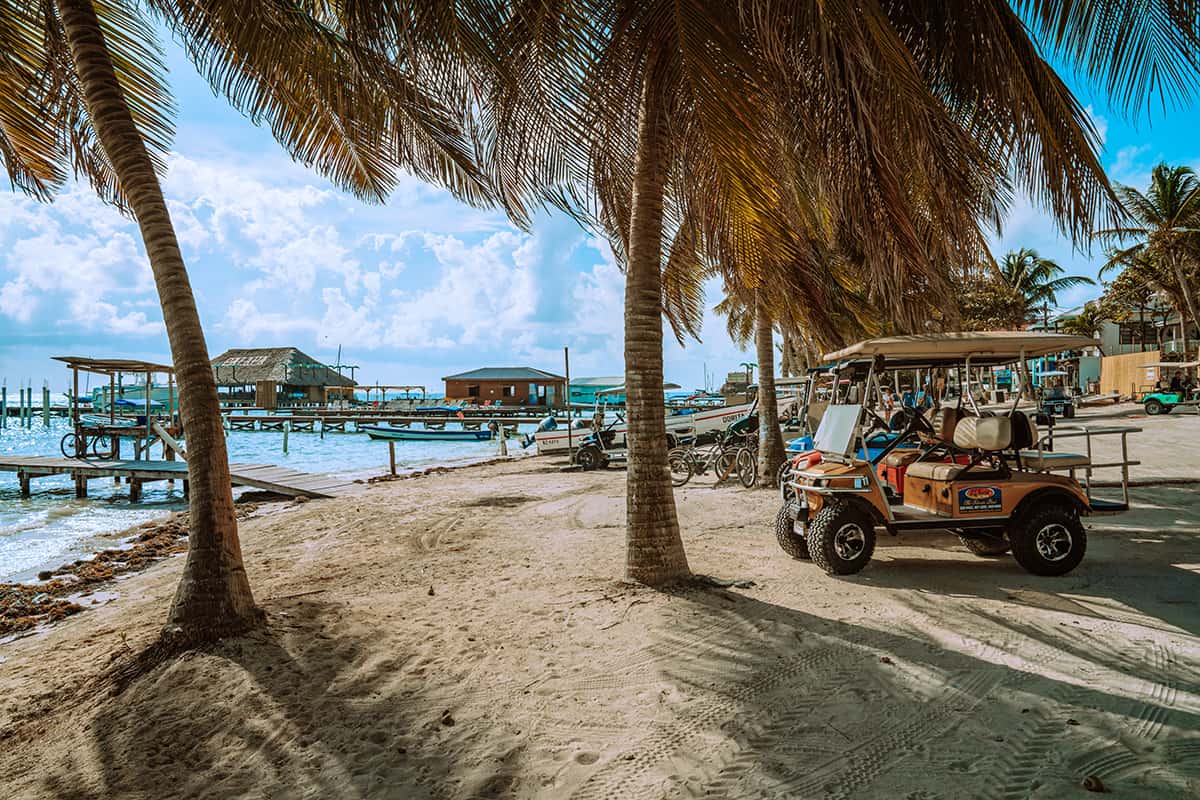 hanging out on the waterfront with the gold buggys lined up in san pedro ambergris caye
