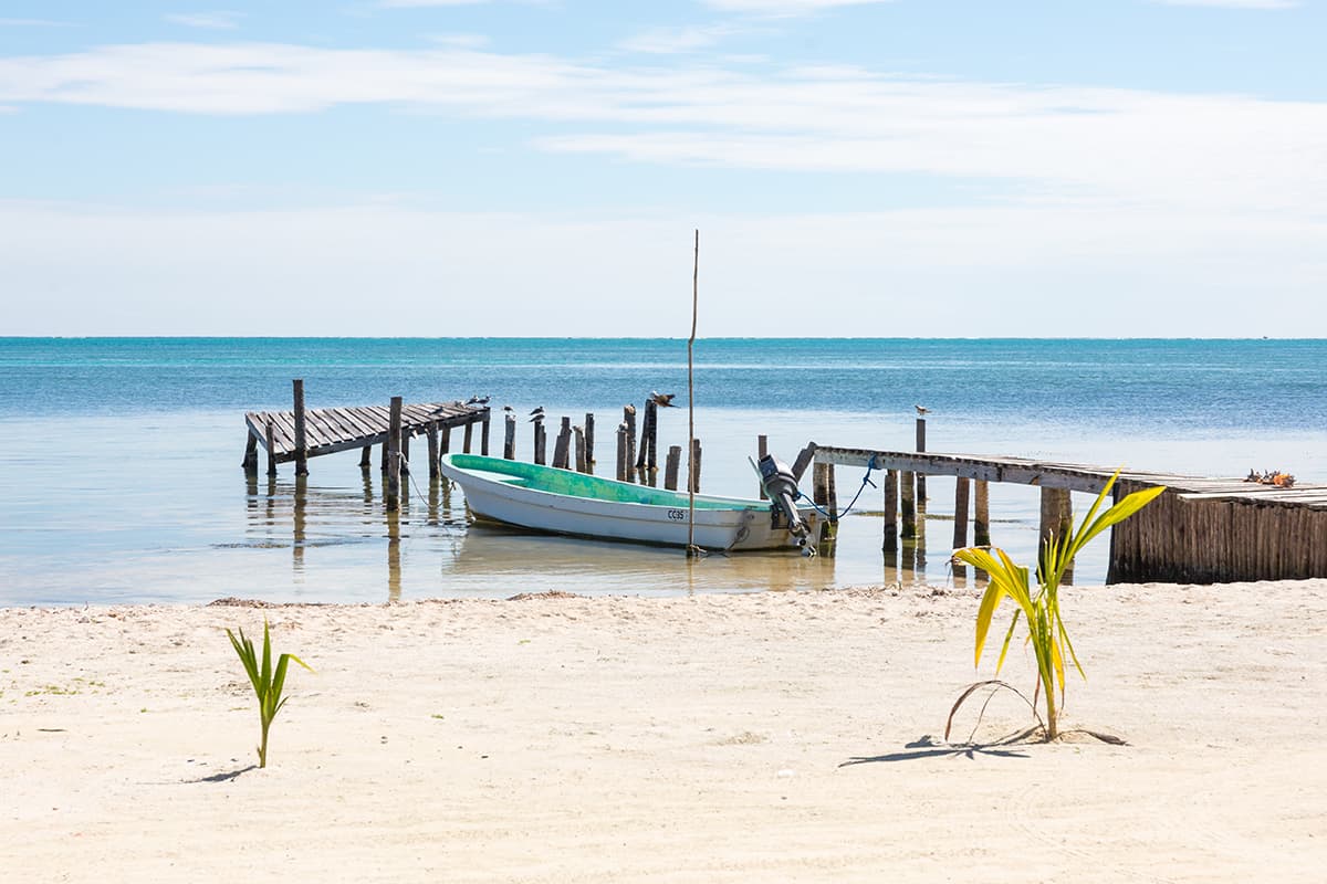 a single boat chilling in the calm waters around caye caulker