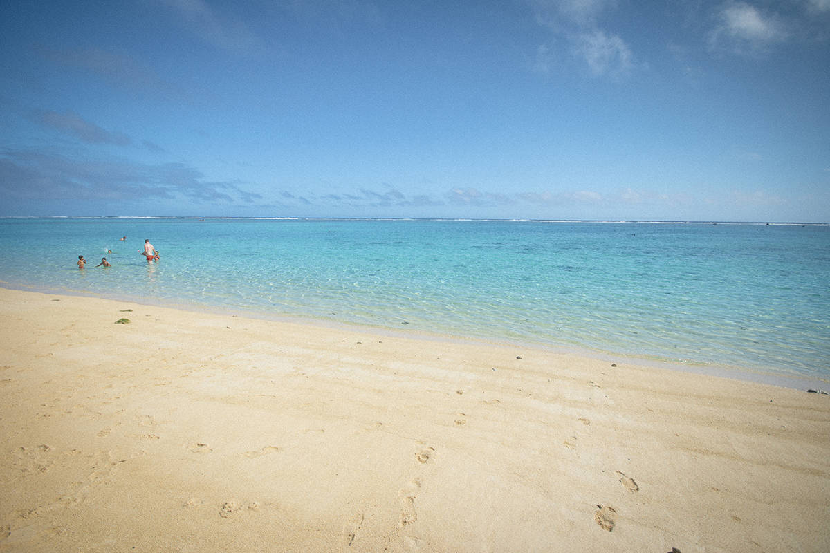 bright blue waters at aroa beach in rarotonga