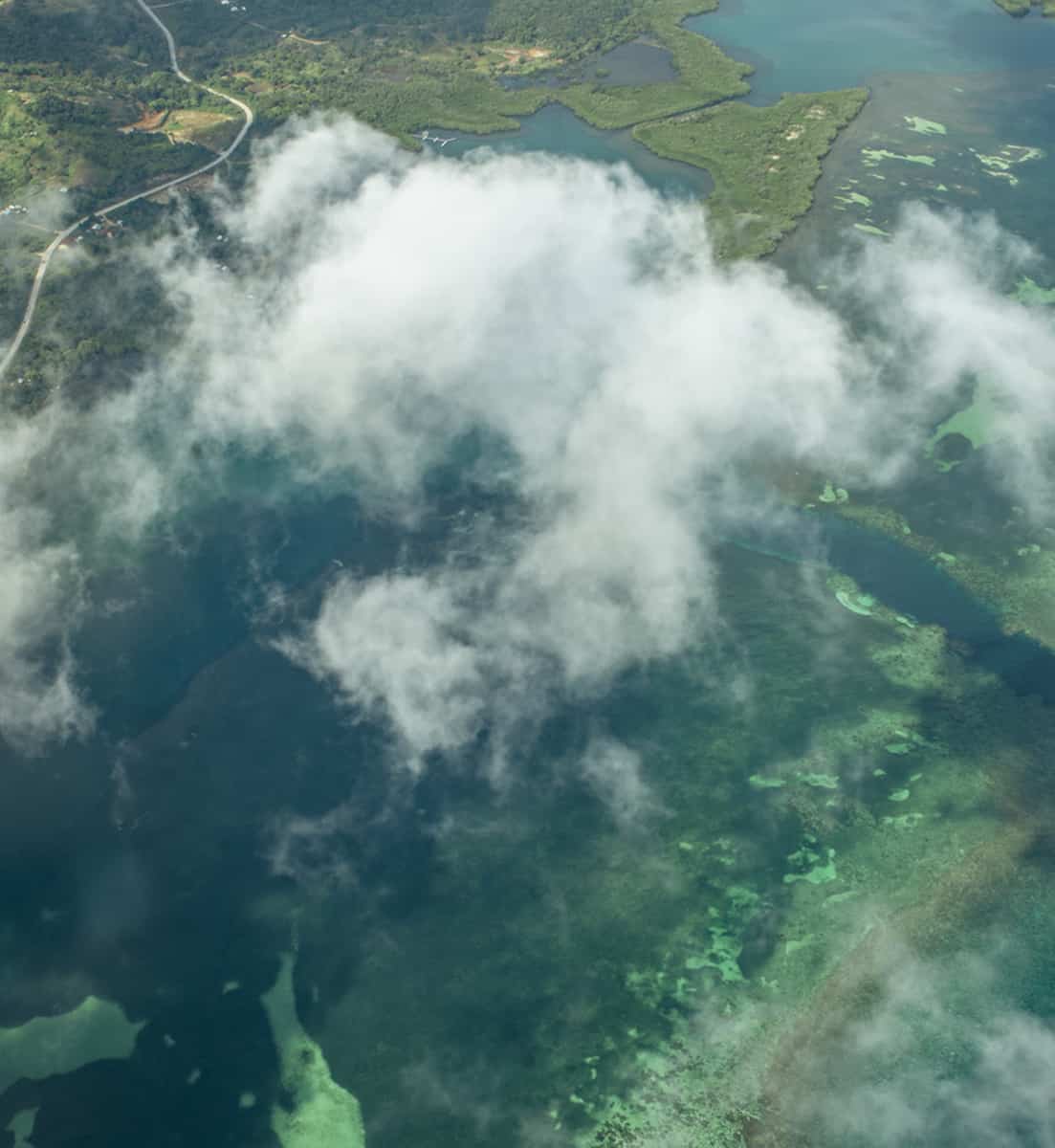 flying over roatan with the incredible reef system and beaches below