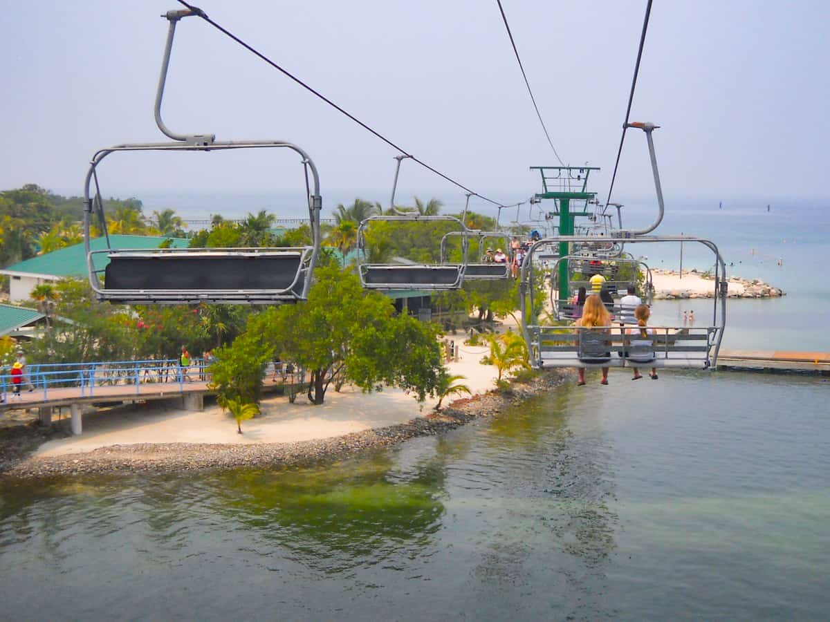 taking the chair lift over to mahogany bay in roatan