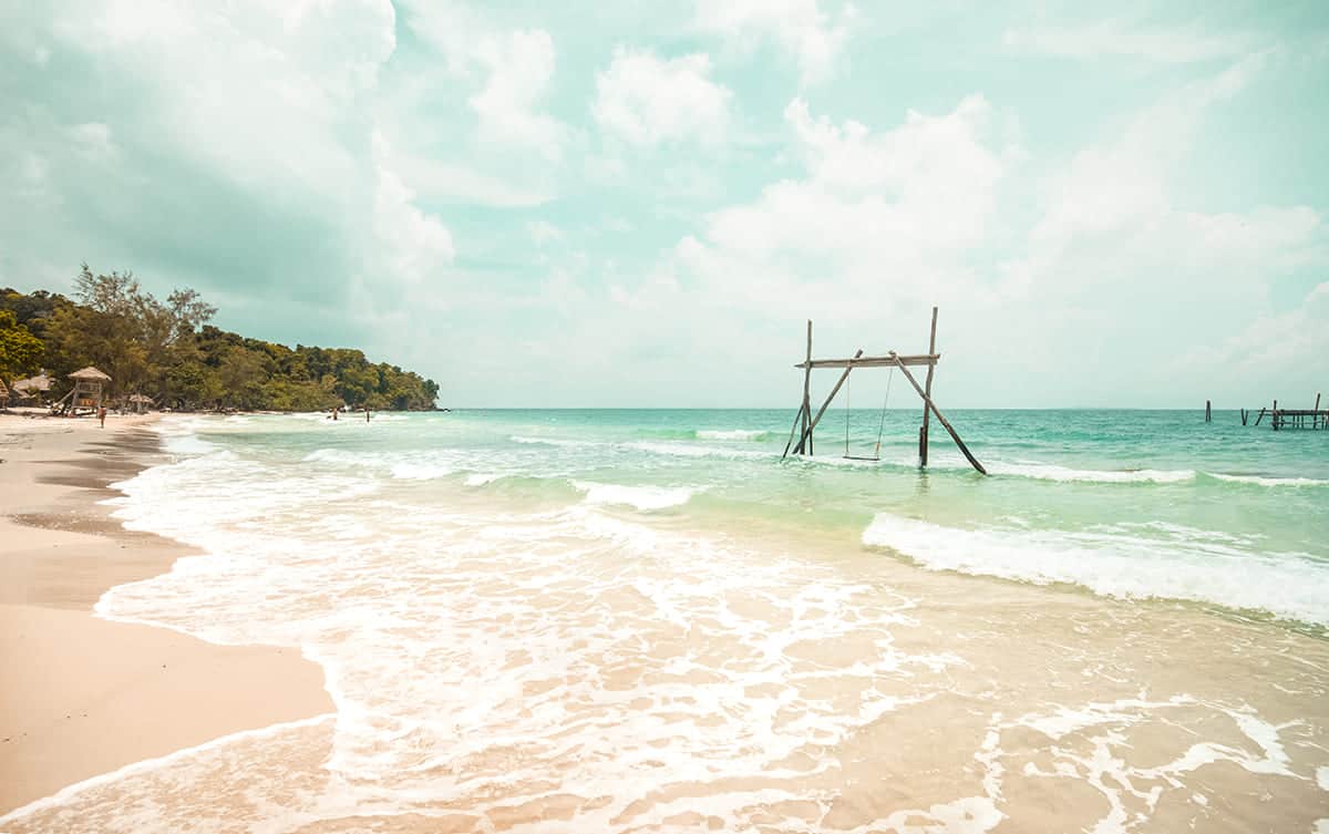 swing and wharf at nature beach before the storm