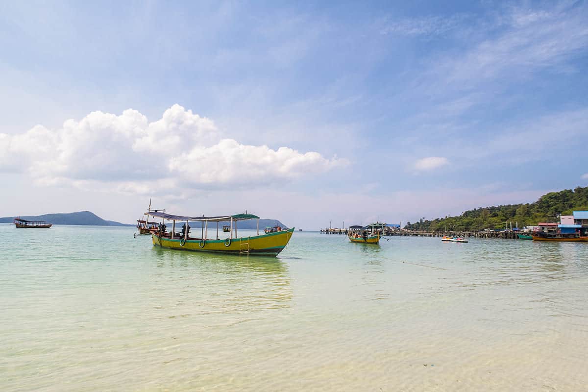 local boats lined up on the waters edge at koh touch beach on koh rong