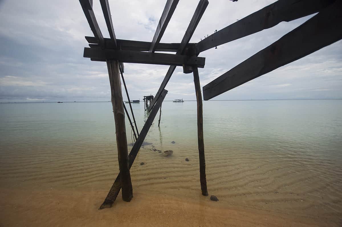 the old pier on sunset beach of koh rong samloem