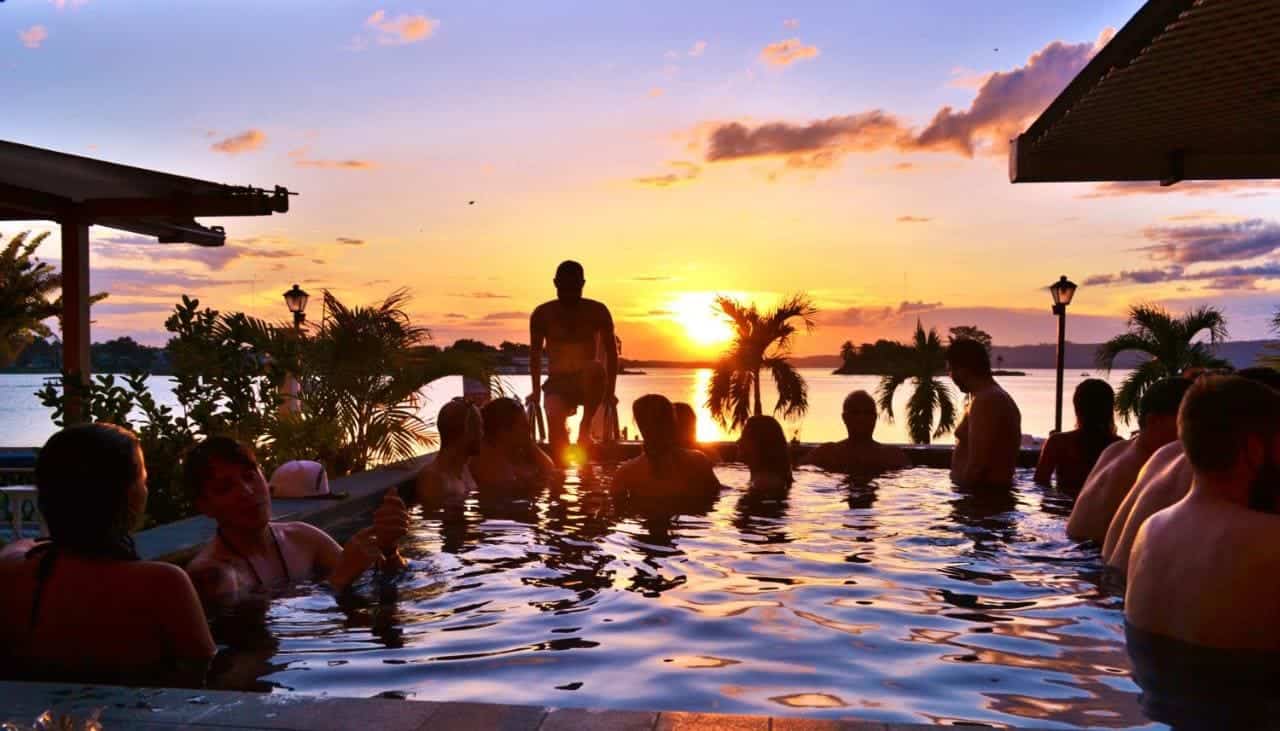 enjoying meeting new people at the pool at hotel peten express