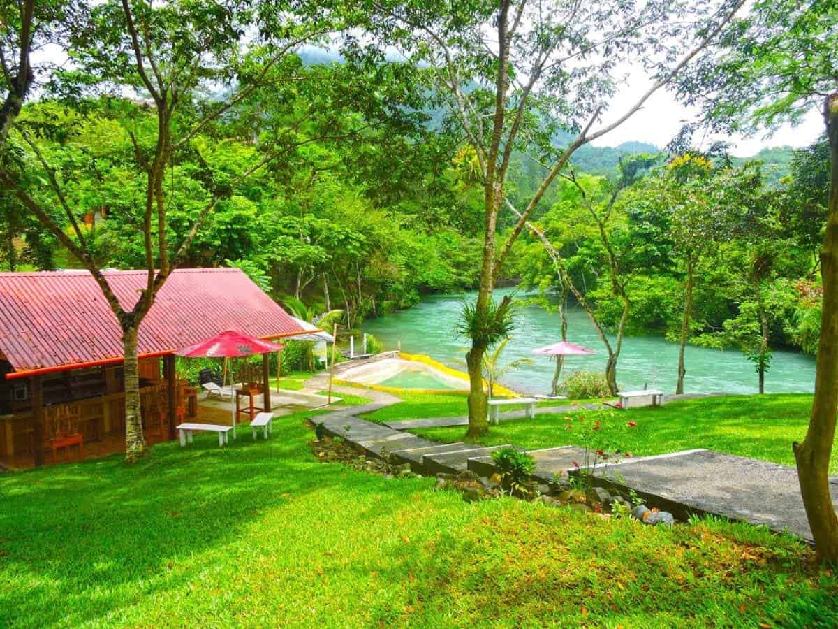 Best Hostels In Semuc Champey: For Solo Travelers, Females, Couples & More 22 checking out the pool overlooking the river at hostal oasis the traveler