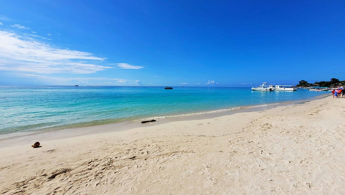 white sand and clear waters at the west end beach