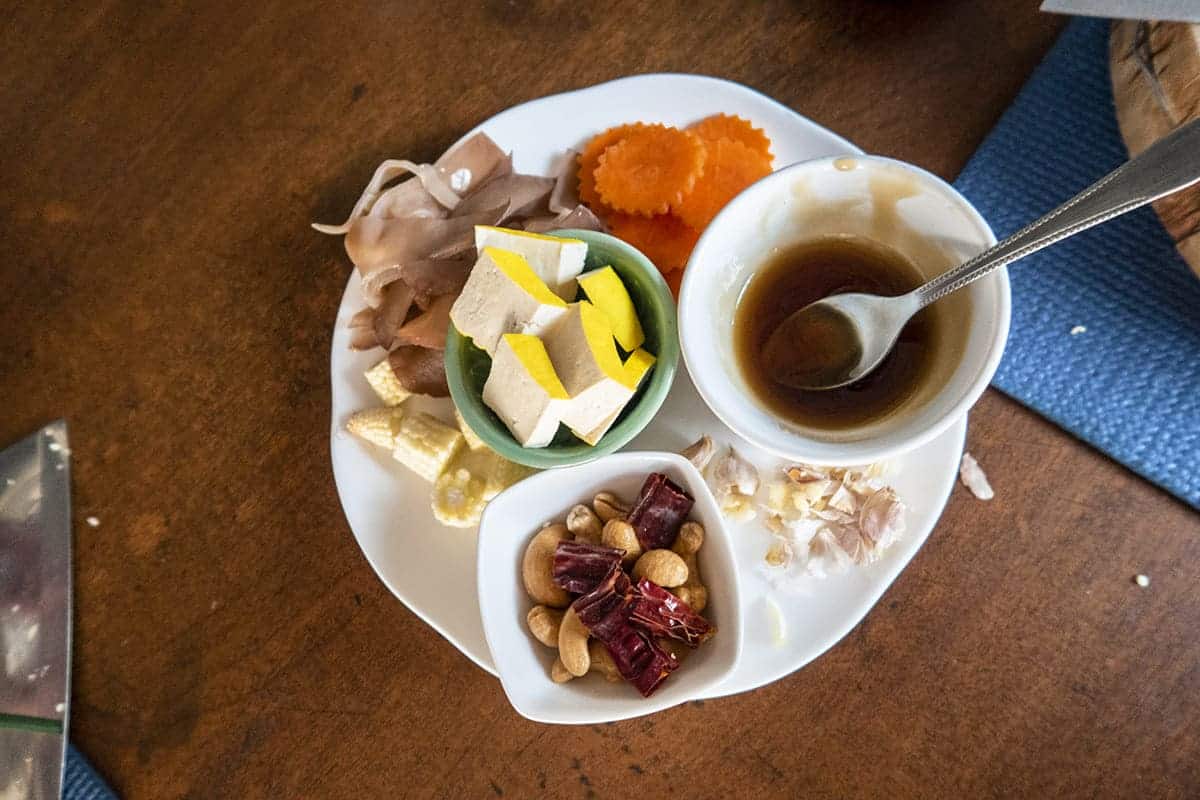 making cashew nut tofu in my vegetarian cooking class in chiang mai