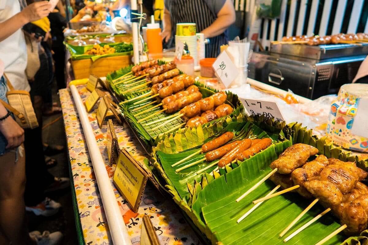 Backpacking Chiang Mai Travel Guide: Costs, Travel Tips and More! 12 barbecue sausage and meats at the chiang mai sunday market