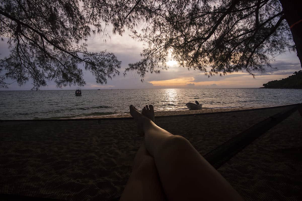 Cost To Travel Cambodia: My $29.00 Per Day Travel Budget 19 watching sunset from a hammock on sunset beach in koh rong samloem