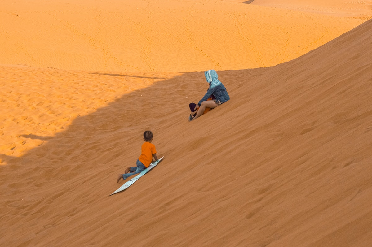 sand boarding at the red sand dunes in mui ne