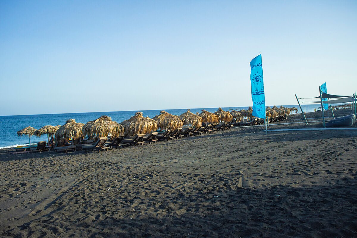 black beach chairs sightseeing santorini