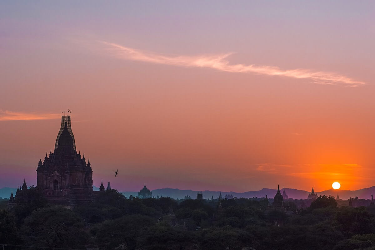 sun setting over bagan
