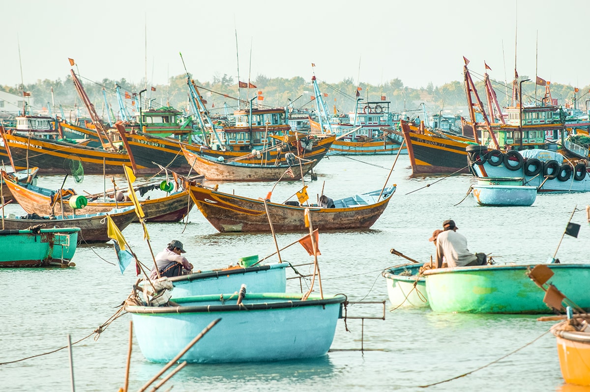 colorful junk boats in the fishing village in mui ne vietnam