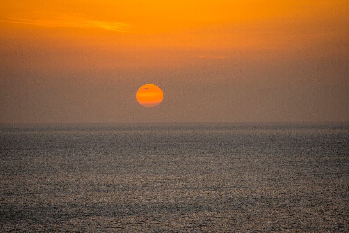sunset from lighthouse sightseeing santorini