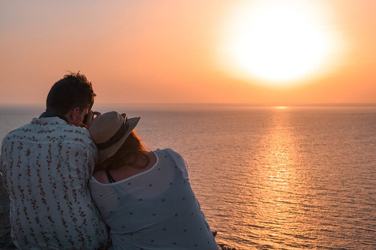 pink sunset sightseeing santorini