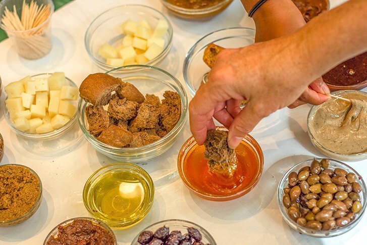 sharing cretan food with athens walking tours