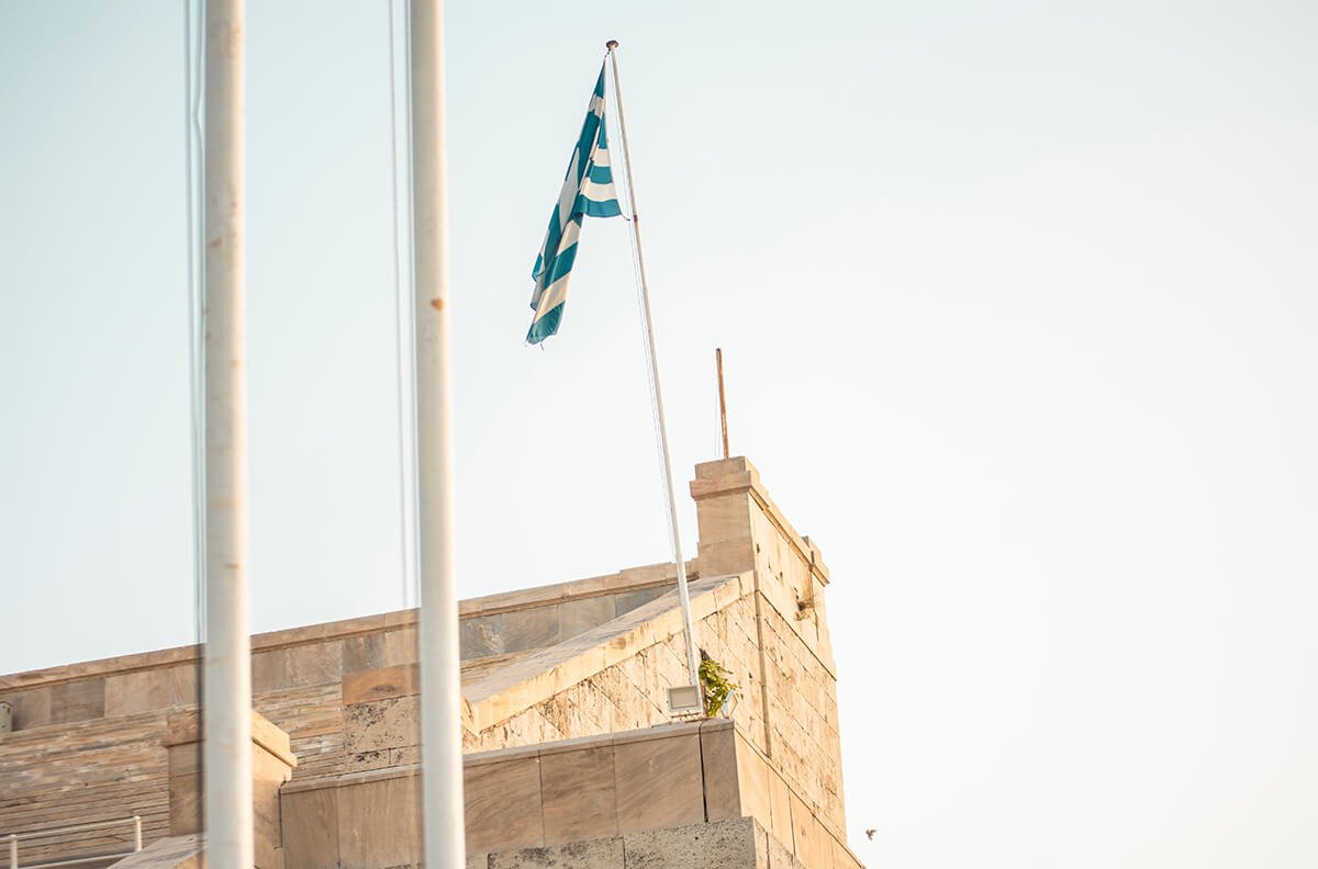 greek flag flying in athens