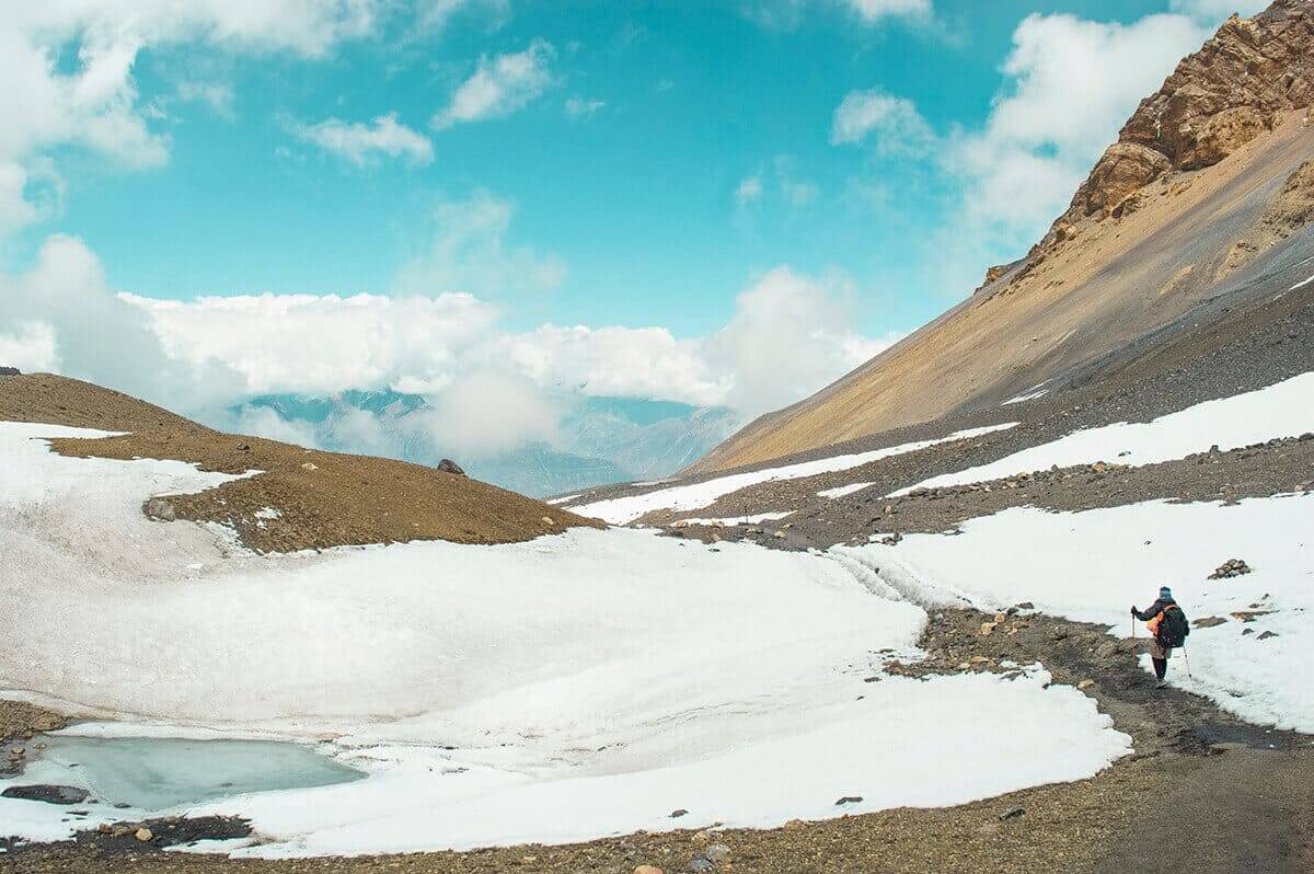 snowy trails high camp to muktinath over thorong la pass on the annapurna circuit