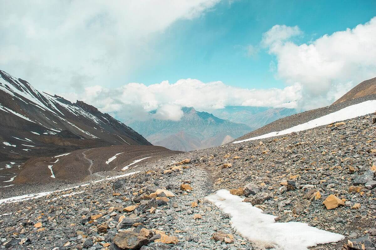 snowy path high camp to muktinath over thorong la pass on the annapurna circuit