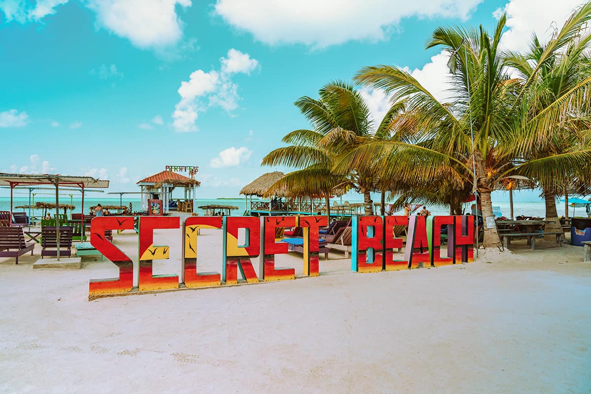 the main signage at secret beach in ambergris caye