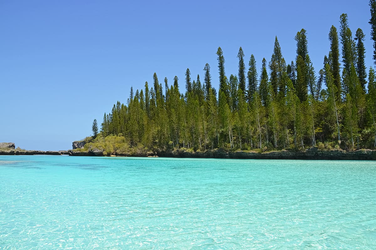 the beautiful isle of pines natural pool during high tide and a sunny day