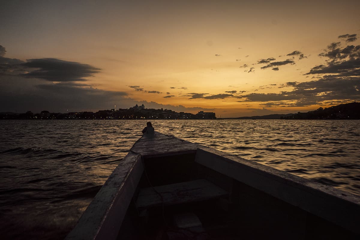 taking the boat back to flores with the town all lit up at night