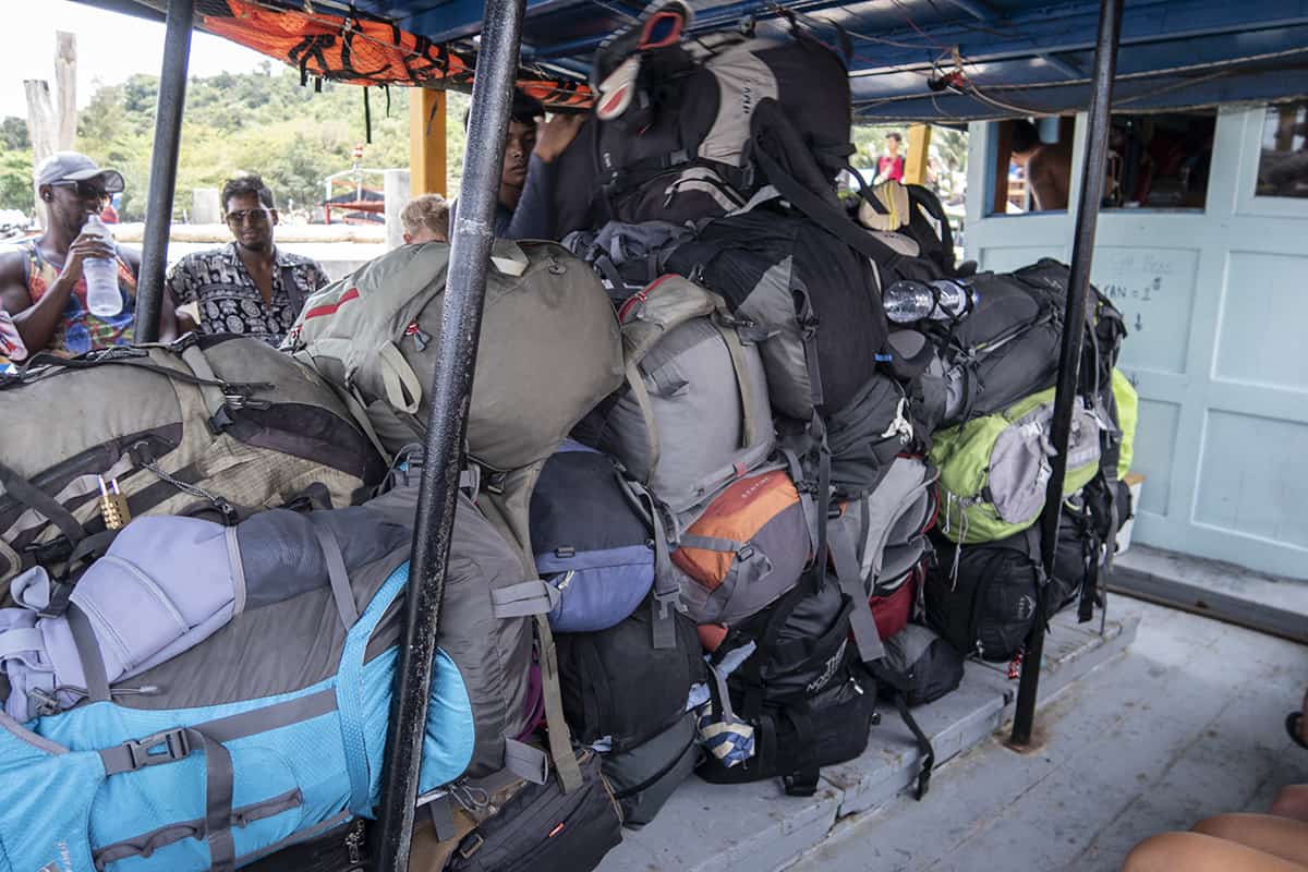 all the travelers bags stacked up on the supply boat