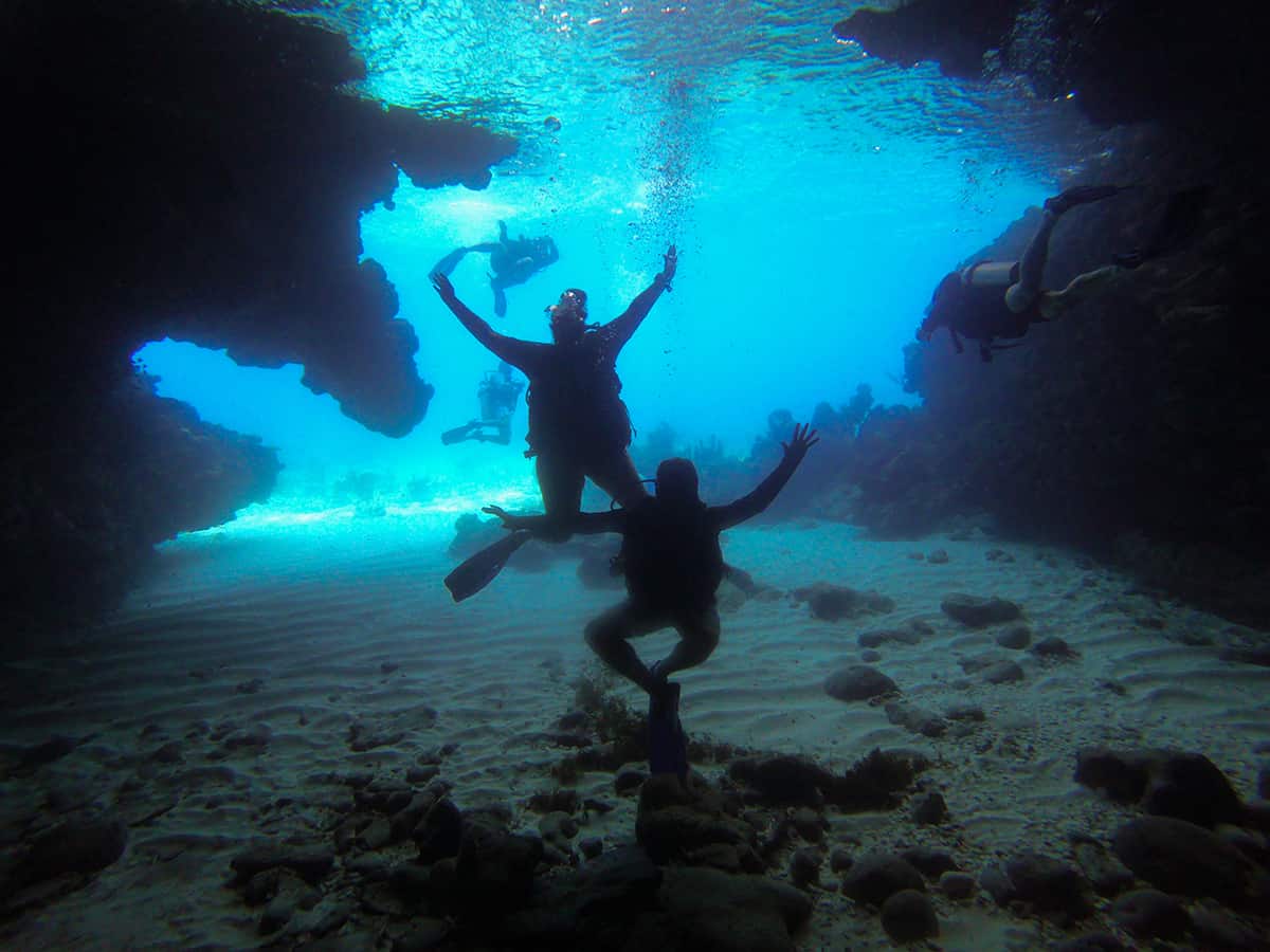 diving inside our first cave in roatan called blue cave, albeit a small one, it still counts