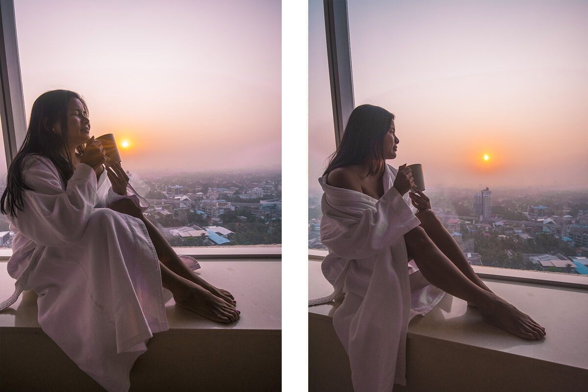 drinking tea watching the sunrise over the city from the Kochi Marriott Hotel in kerala, india