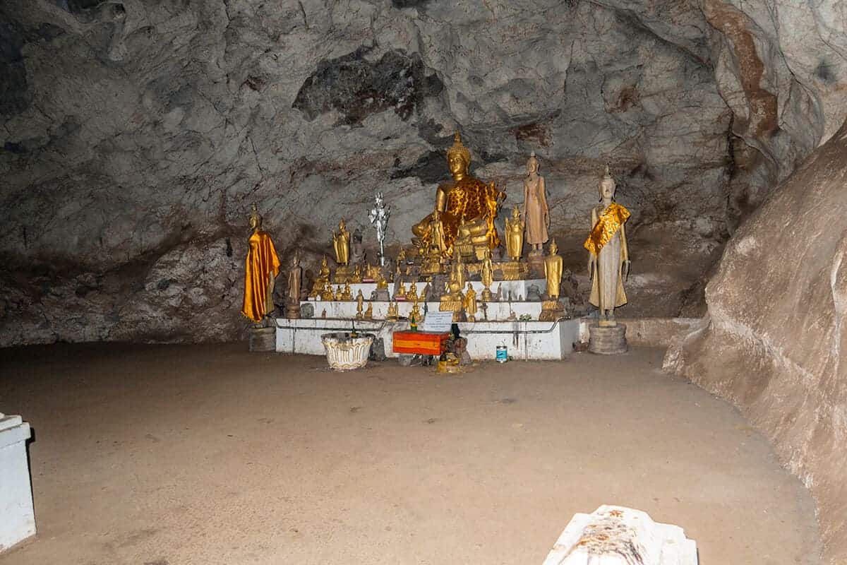 buddhas on a stand in the Tham Theung upper pak ou caves