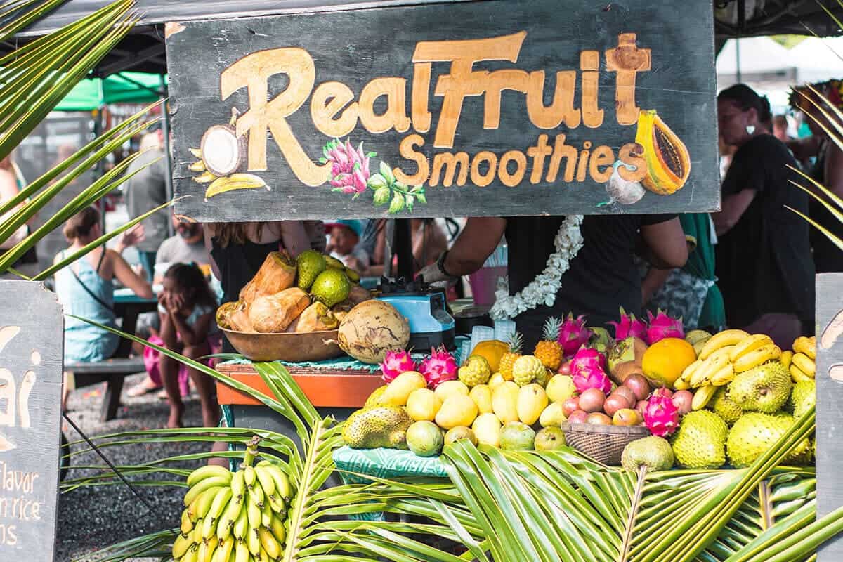 an assortment of fresh fruits at a smoothie stand in rarotonga