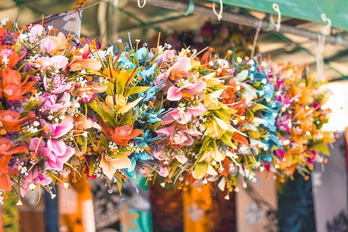 flower crowns hanging up at the punanga nui market in rarotonga