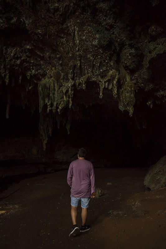 Queen Hortense's Cave In The Isle Of Pines: BEST Tips 2025 6 A man standing in front of Queen Hortense’s Cave.