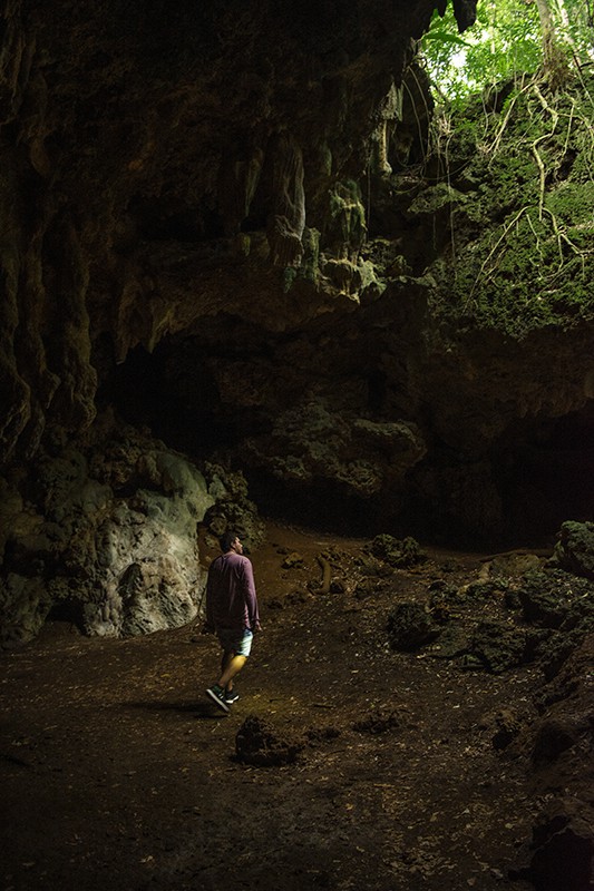 Queen Hortense's Cave In The Isle Of Pines: BEST Tips 2025 12 A man standing in front of Queen Hortense's Cave on the Isle Of Pines.