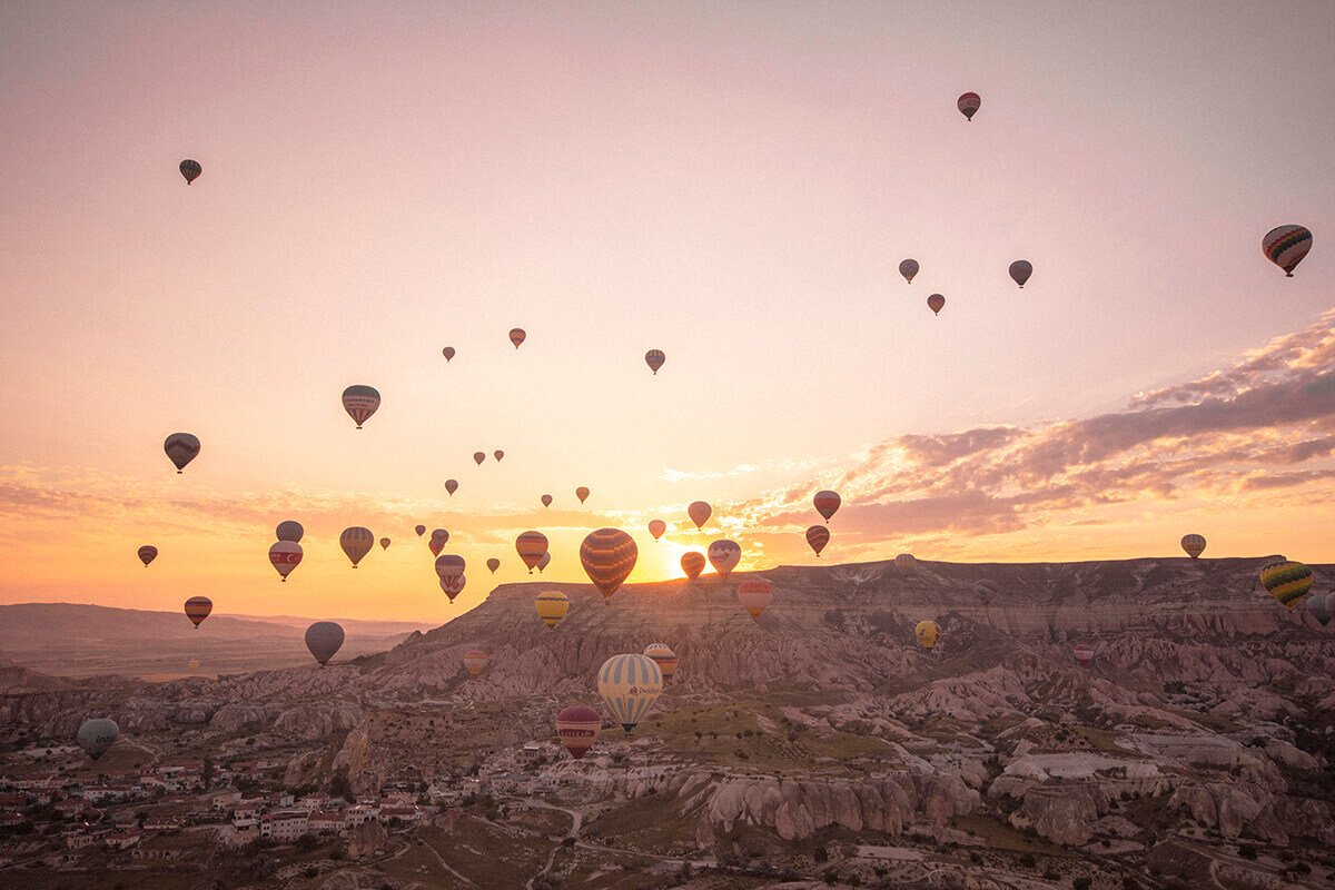 sunrise over mountains hot air ballooning cappadocia