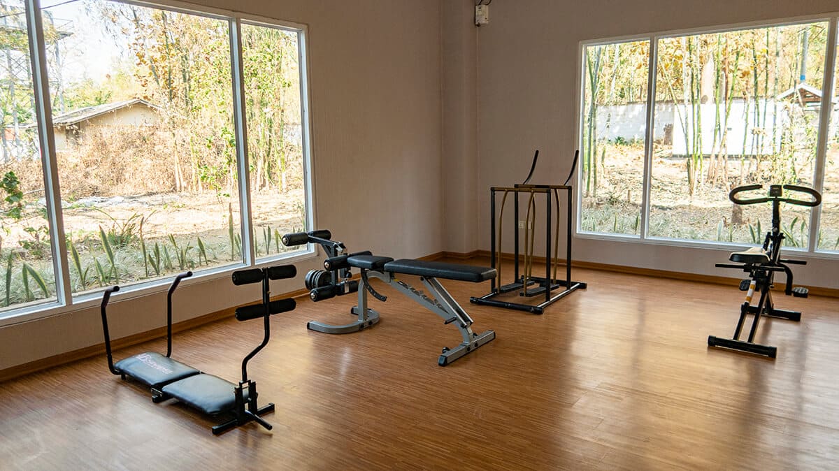 gym machines in back building of the resort