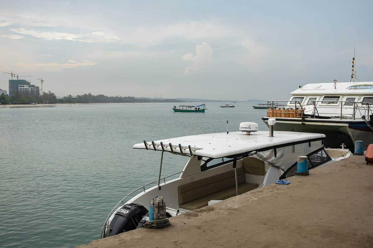 boats lined up along the pier in sihanoukville to koh rong