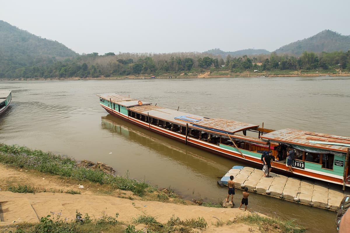 Cost To Travel Laos And My Laos Travel Budget: $30.00 Per Day 15 disembarking our slow boat in luang prabang